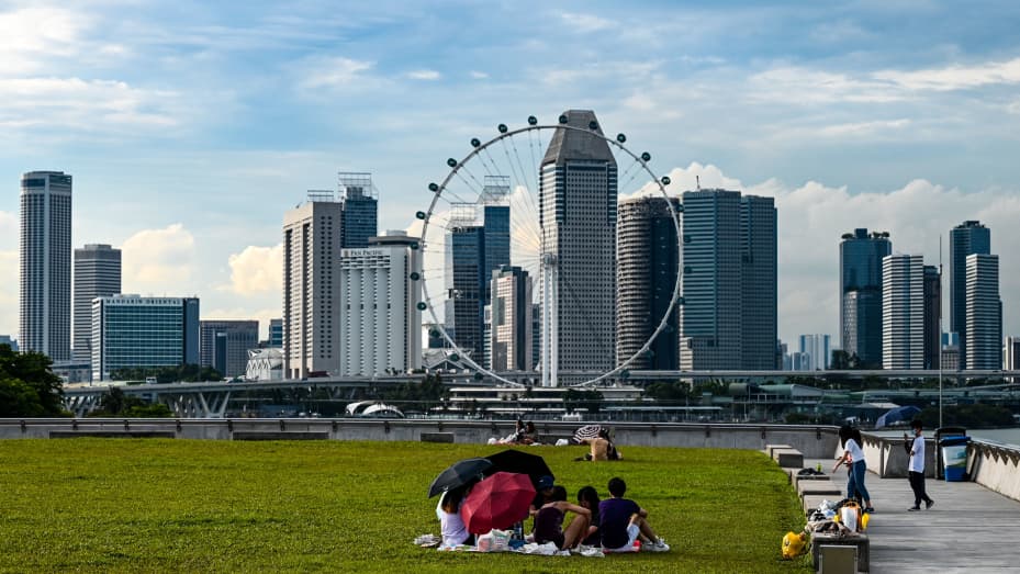 People picnic on the green roof of Marina Barrage in Singapore on Oct. 10, 2022.