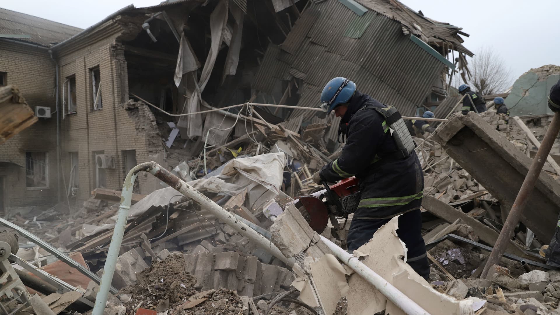 Rescuers clear debris of the destroyed two-storey maternity building in the town of Vilnyansk, southern Zaporizhzhia region, on November 23, 2022, amid the Russian invasion of Ukraine.