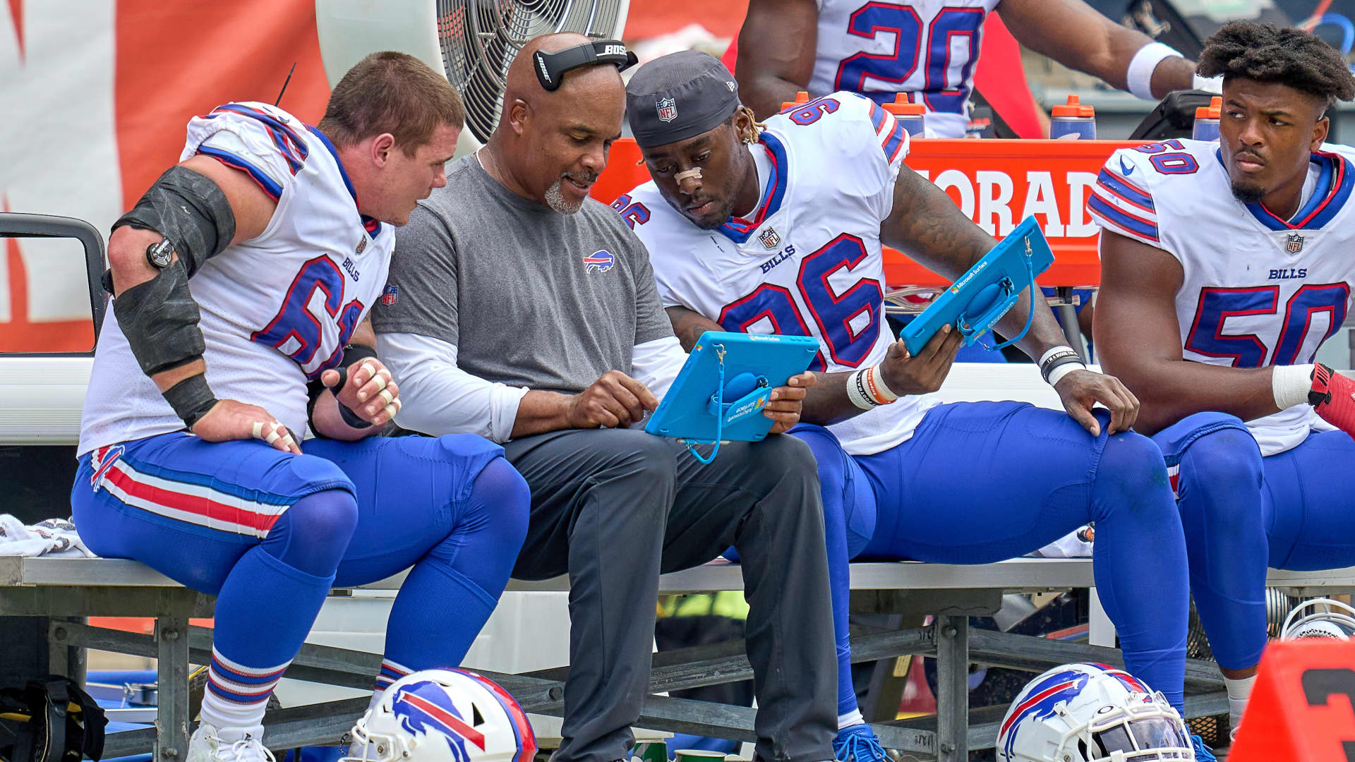 Buffalo Bills defensive line coach Eric Washington reviews plays on a Microsoft Surface tablet