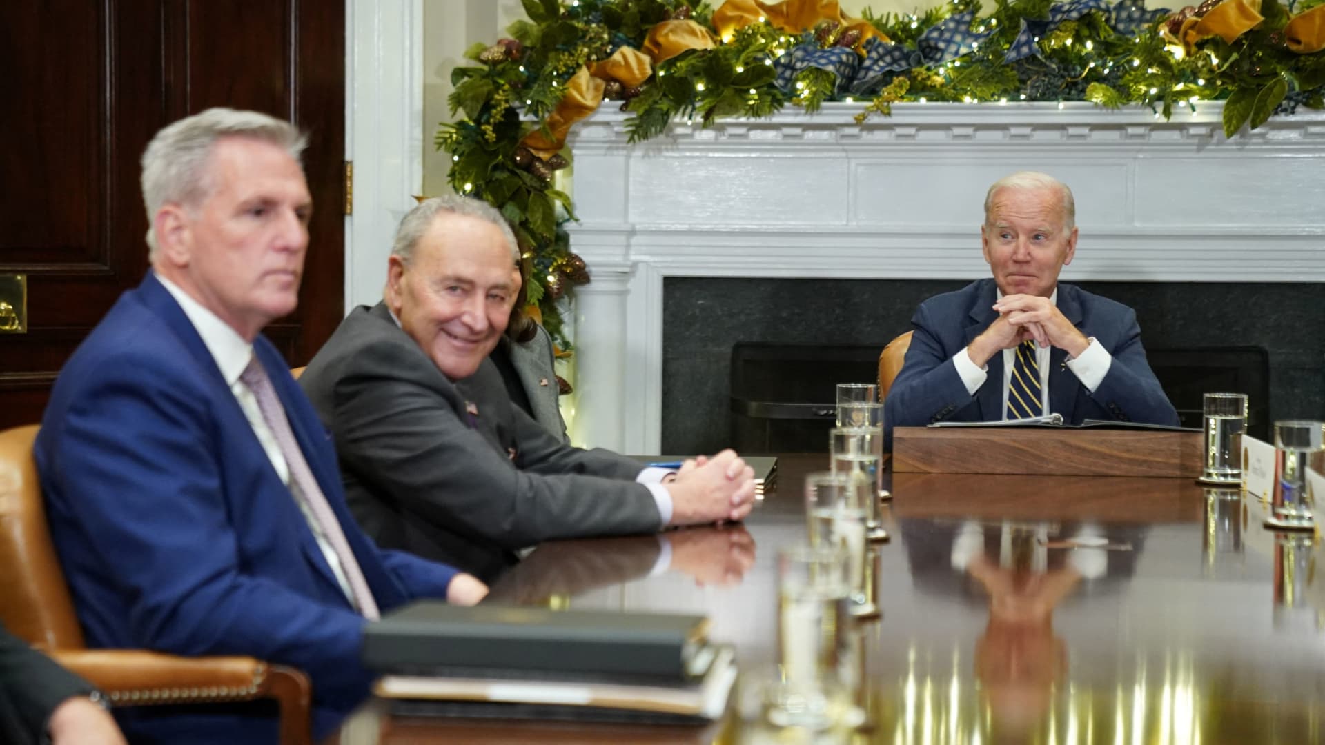 U.S. President Joe Biden looks toward House Republican leader Kevin McCarthy and Senate Majority Leader Chuck Schumer, during a meeting with congressional leaders at the White House in Washington, U.S., November 29, 2022. 