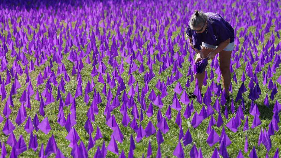 Holly Francis, a volunteer with Boston Medical Center helped to plant some of the 20,000 purple flags in the Common that commemorate Overdose Awareness Day and kick off Recovery Month. Each purple flag represents one life lost to overdose in Massachusetts over the past 10 years.