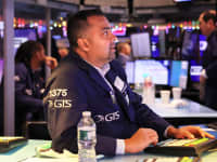 Traders work on the floor of the New York Stock Exchange during morning trading on December 2, 2022 in New York City.
