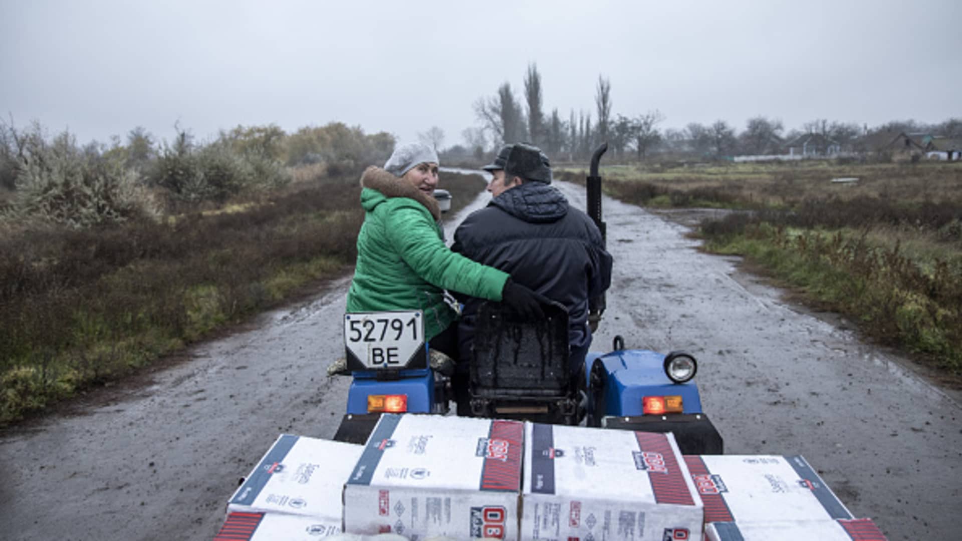 Locals transfer humanitarian aid supplies near Novopetrivka, following the withdrawal of Russian troops from Kherson region, Ukraine, on Nov. 17, 2022.
