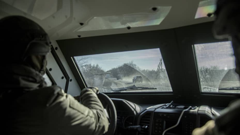 Ukrainian servicemen drive an armored vehicle near the Toretsk frontline in Donbas, Ukraine, on Dec. 2, 2022.