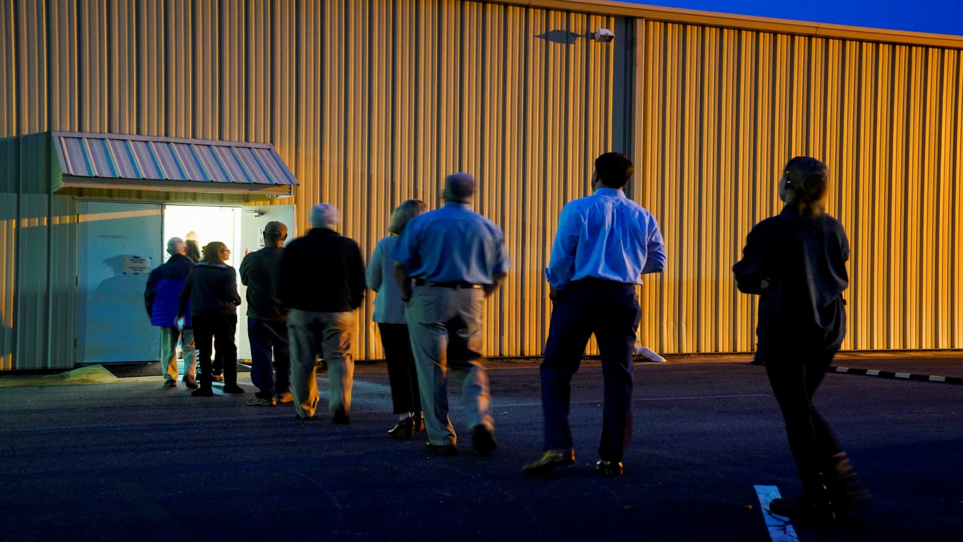 Local residents wait in line to cast their ballots during the midterm runoff elections at Central Baptist Church in Columbus, Georgia, U.S., December 6, 2022. 