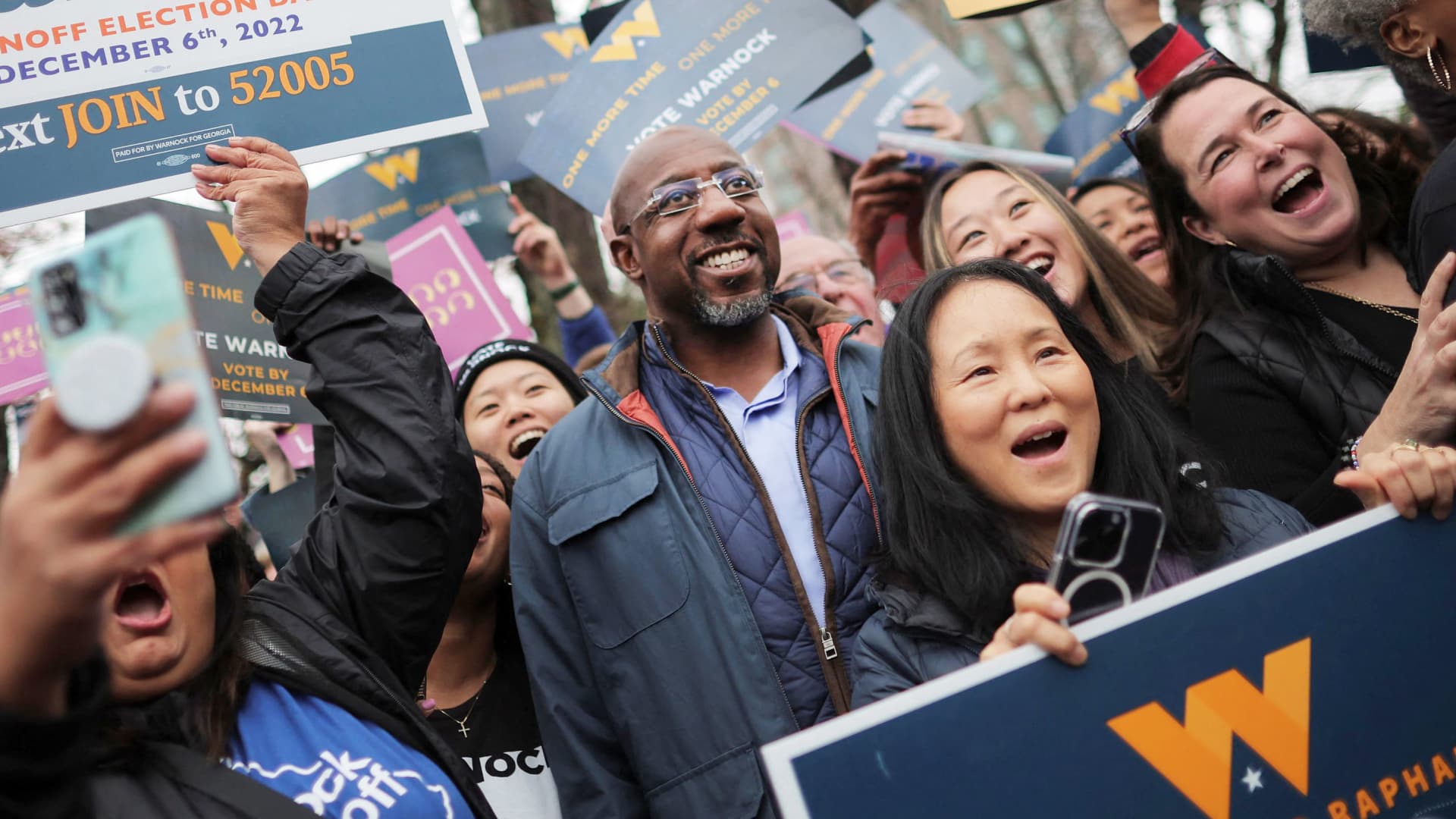 Reverend Raphael Warnock, Democratic Senator for Georgia, gather with supporters during the midterm Senate runoff elections in Norcross, Georgia, December 6, 2022.