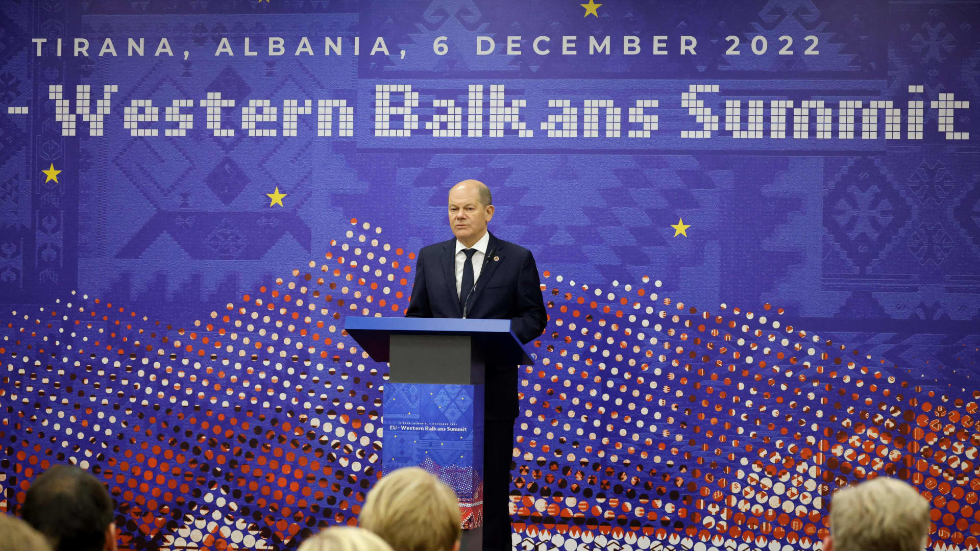 German Chancellor Olaf Scholz addresses journalists during a press conference following the EU Western Balkans summit in Tirana on December 6, 2022.