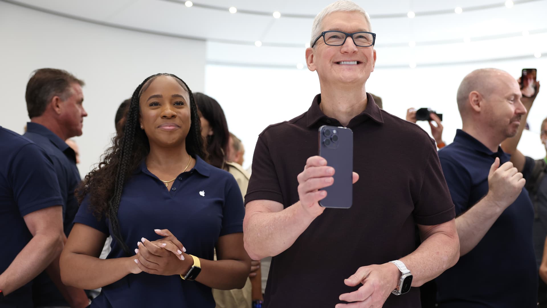 Apple CEO Tim Cook holds a new iPhone 14 Pro during an Apple special event on September 07, 2022 in Cupertino, California.