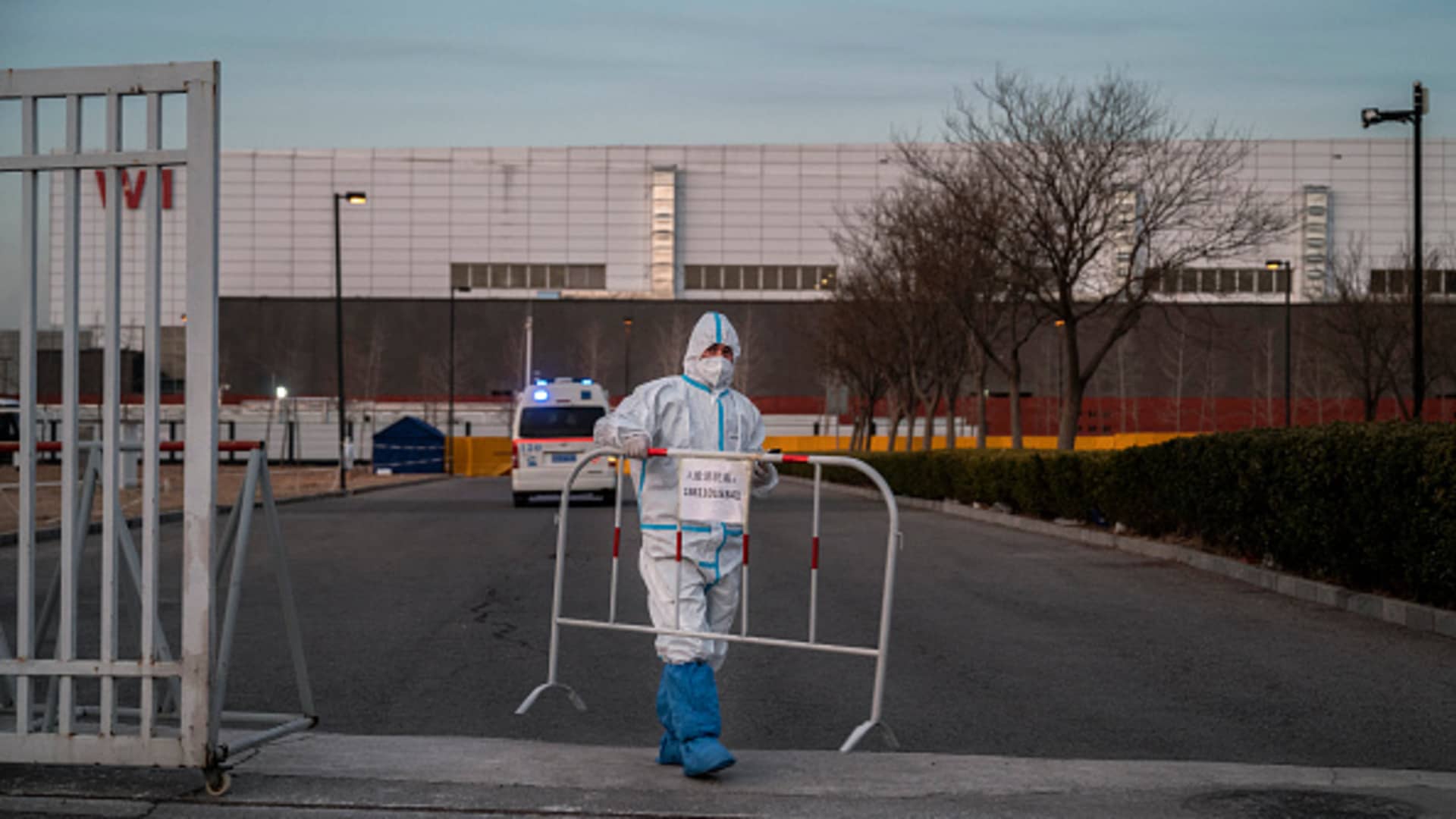 An epidemic control worker outside a government quarantine facility in Beijing on Dec. 7, 2022.