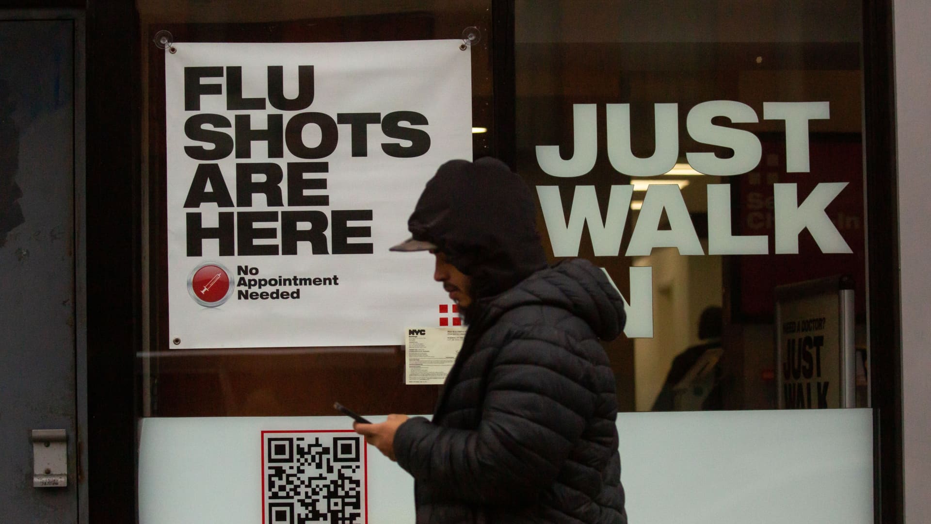 A man walks past an urgent care facility offering flu shots in New York, the United States, on Dec. 7, 2022.