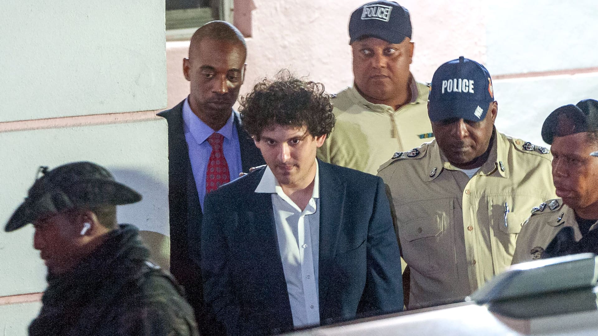 Photos show disgraced FTX founder Sam Bankman-Fried cuffed in Bahamas on his way to jail