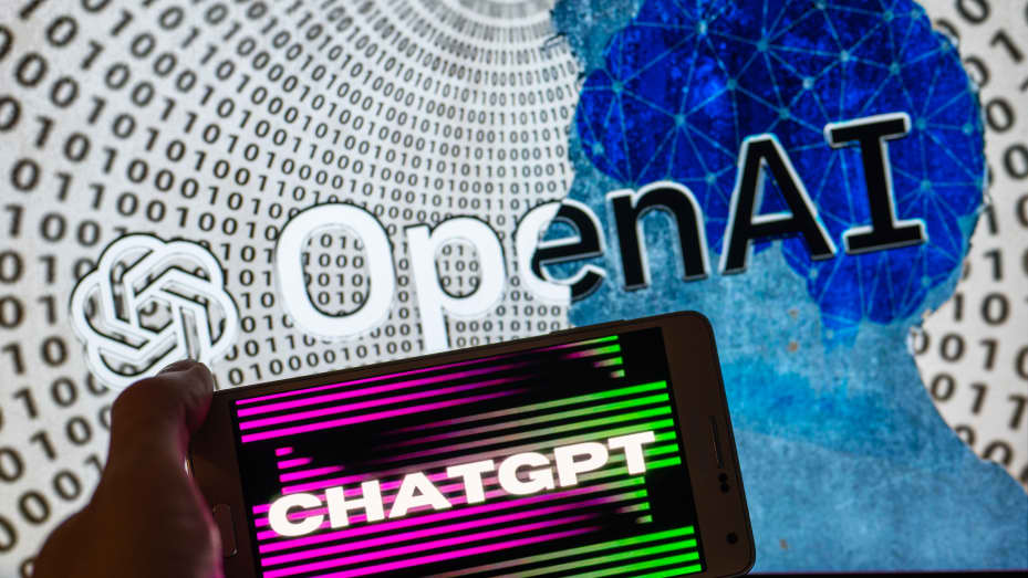 OpenAI logo seen on screen with ChatGPT website displayed on mobile seen in this illustration in Brussels, Belgium, on December 12, 2022.