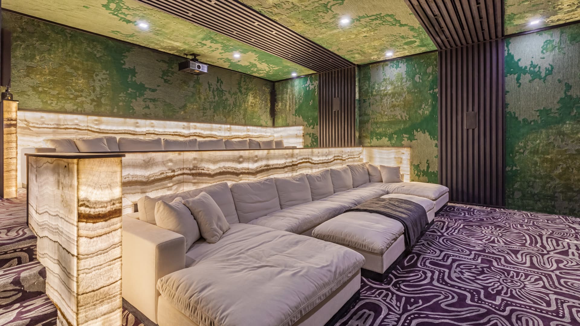 The the home cinema features a state-of-the-art Dolby Atmos sound system, carpeting imported from New Zealand and more illuminated stone.