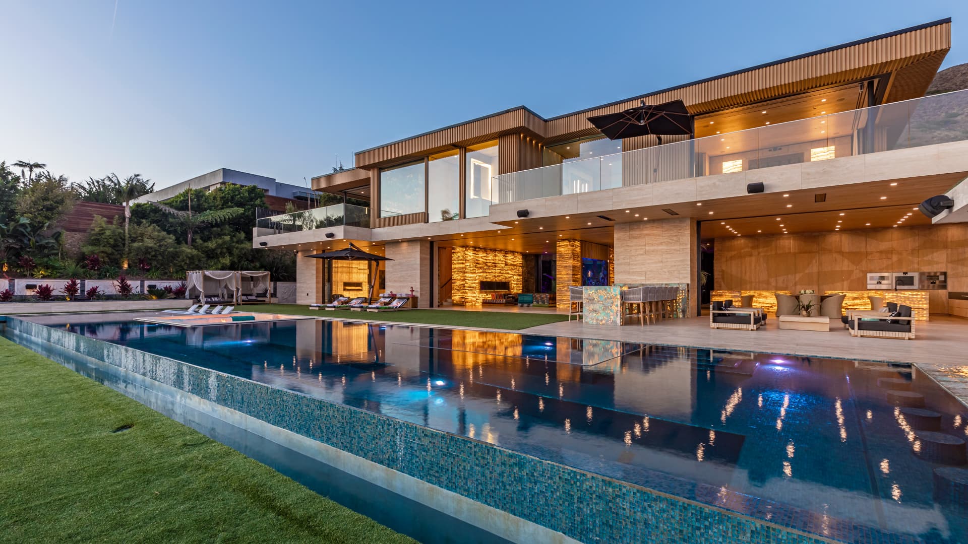 Glass walls on the home's lower level open to the sun deck and swimming pool.