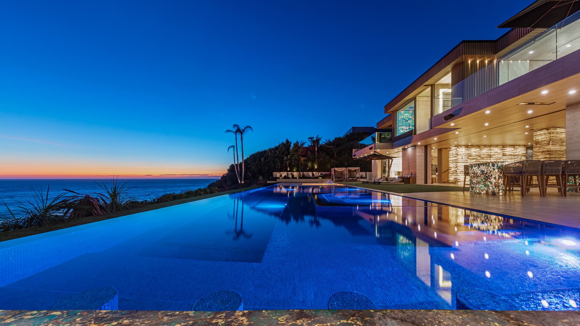 The mansion at 11870 Ellice St sits above the Pacific Coast Hwy in Malibu overlooking the ocean.
