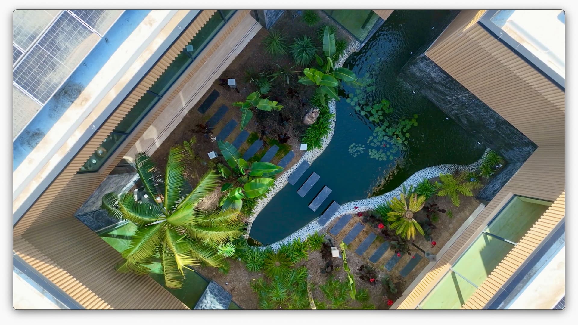 Aerial view of the home's open-air courtyard and koi pond.