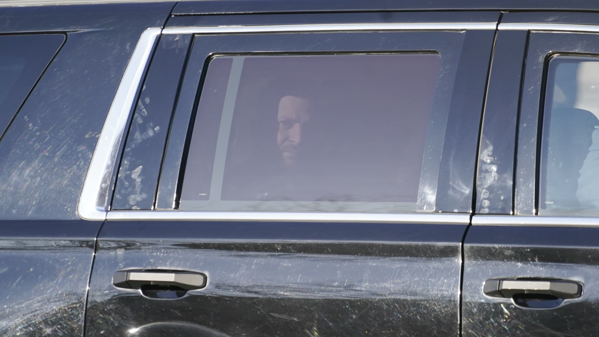 Ukrainian President Volodymyr Zelenskyy looks out as he is driven to the White House in Washington, Wednesday, Dec. 21, 2022.
