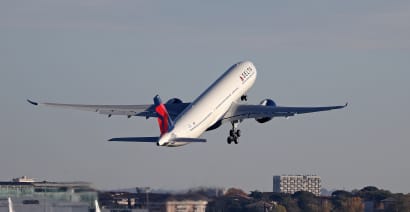 Delta more than doubles fourth-quarter profit, but trims 2024 earnings forecast