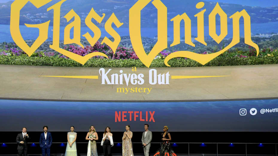 (L-R) Rian Johnson, Ram Bergman, Jessica Henwick, Madelyn Cline, Kathryn Hahn Kate Hudson, Edward Norton, and Janelle Monáe speak onstage during Netflix's "Glass Onion: A Knives Out Mystery" U.S. premiere at the Academy Museum of Motion Pictures.