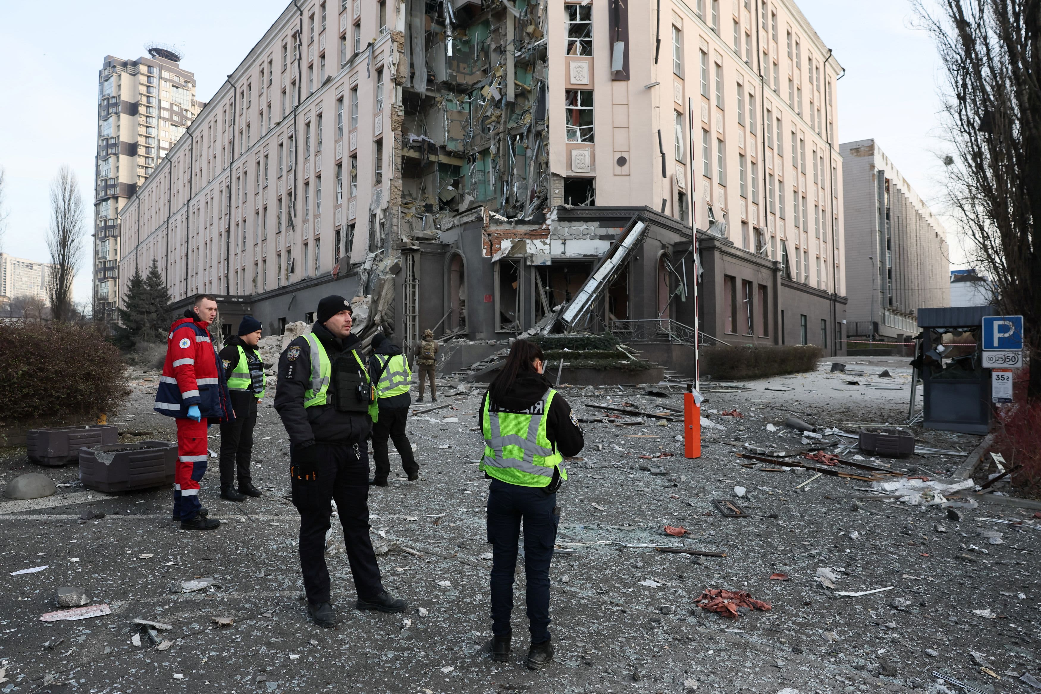 Rescuers work at a site of a building damaged during a Russian missile strike, amid Russias attack on Ukraine, in Kyiv, Ukraine December 31, 2022. REUTERS/Gleb Garanich