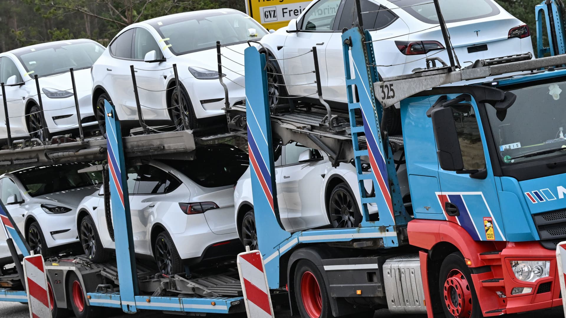 New Model Y electric vehicles are picked up by a truck from the Tesla Gigafactory Berlin-Brandenburg plant by US electric carmaker Tesla. Tesla says it currently employs more than 7000 people at its Grünheide plant.