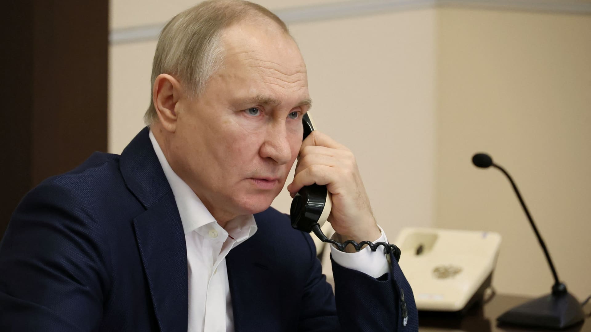 Russia's President Vladimir Putin speaks on the phone during a conversation with Agatha Bylkova from the Kurgan region, an 8-year-old participant of a New Year's and Christmas charity event, in Moscow, Russia, January 3, 2023. 