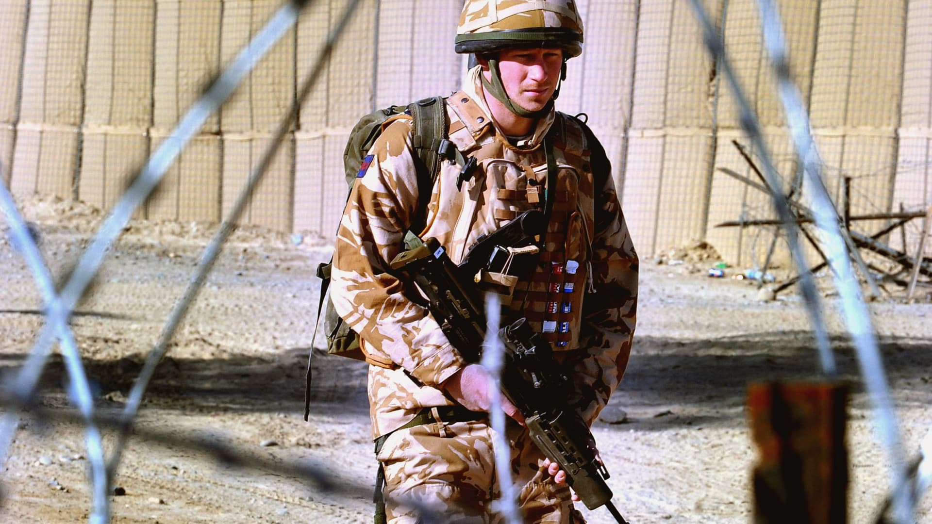 Prince Harry patrols the deserted town of Garmisir on January 2, 2008 in Helmand Province, Afghanistan.