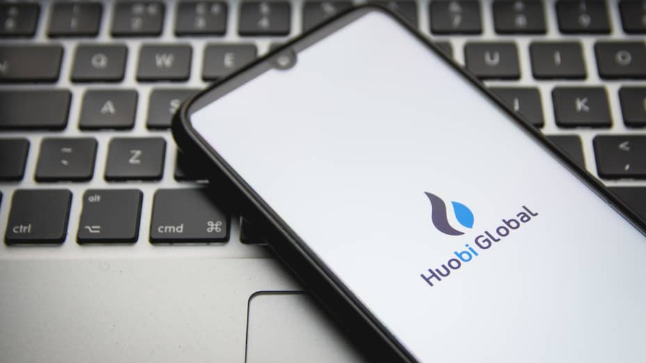 The Huobi crypto exchange logo displayed on a smartphone.