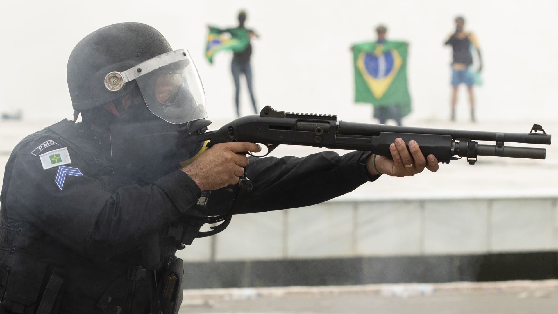Supporters of former President Jair Bolsonaro clash with security forces as they raid the National Congress in Brasilia, Brazil, 08 January 2023.