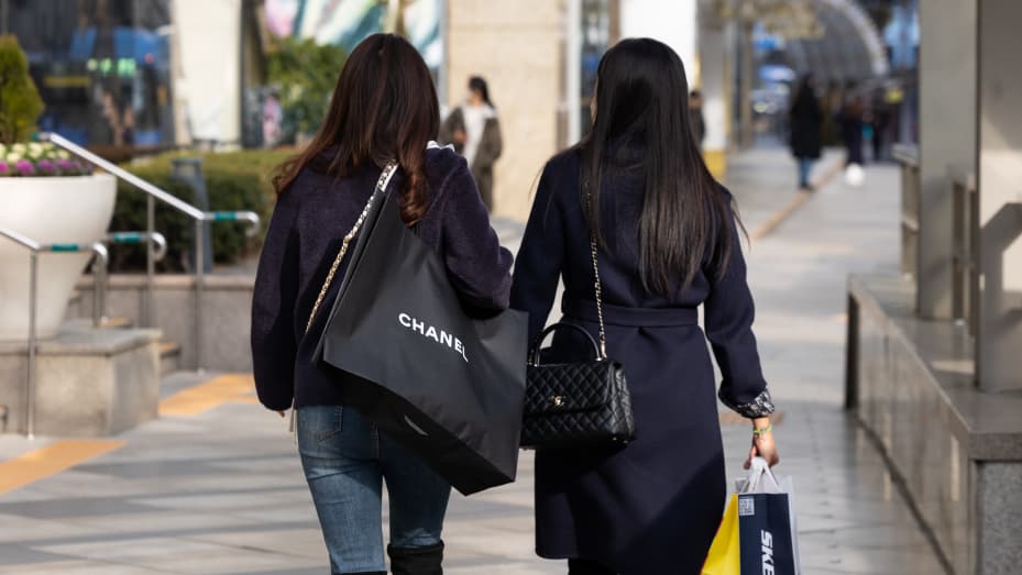 A customer carries a Chanel SA shopping bag in Seoul, South Korea, on Tuesday, Dec. 14, 2021.