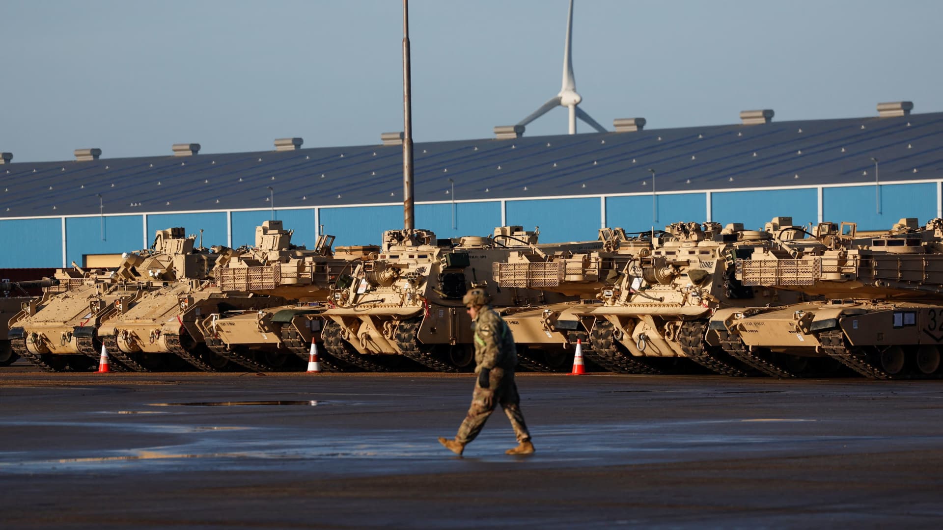 U.S. army vehicles including tanks are brought ashore in the Netherlands as a military unit is transported to Poland and Lithuania as part of a NATO mission to reinforce the alliance's eastern flank after the Russian invasion of Ukraine, in Vlissingen, Netherlands January 11, 2023.