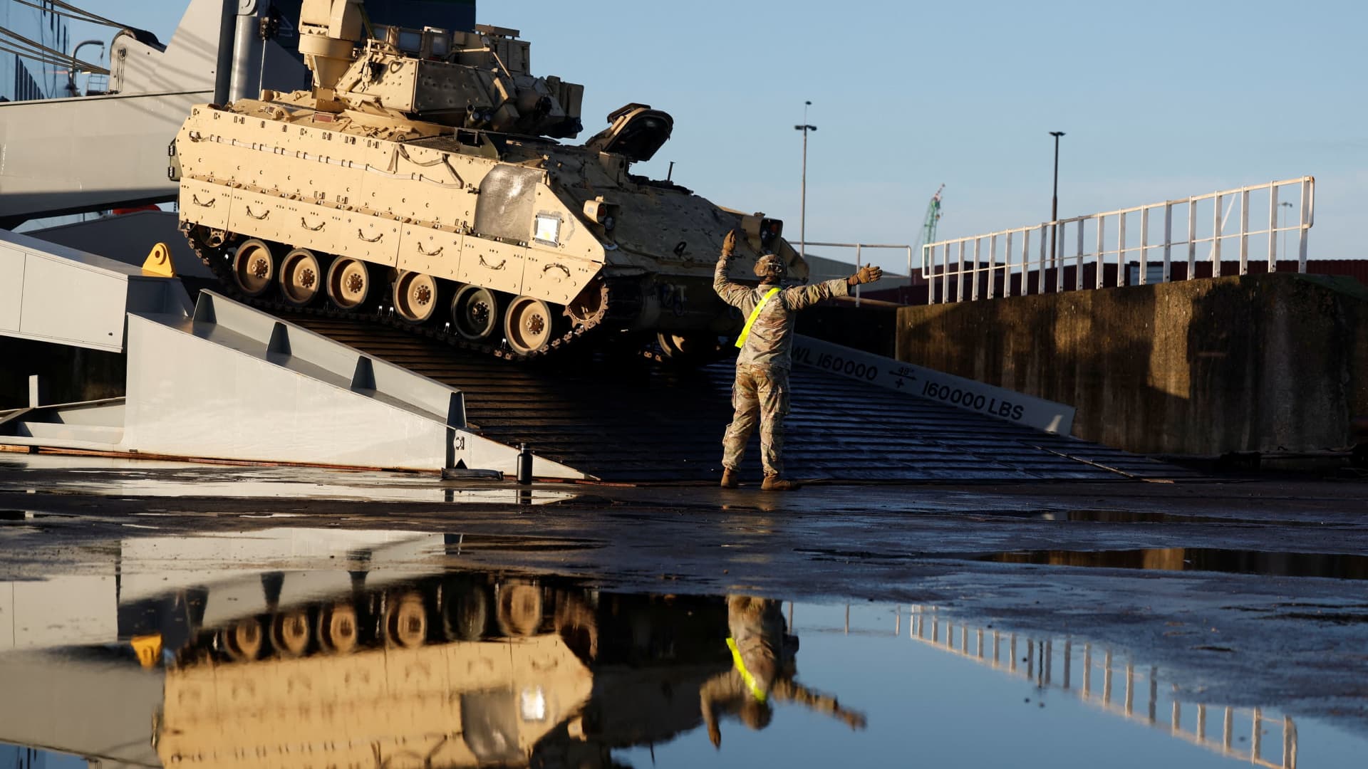 U.S. army vehicles including tanks are brought ashore in the Netherlands as a military unit is transported to Poland and Lithuania as part of a NATO mission to reinforce the alliance's eastern flank after the Russian invasion of Ukraine, in Vlissingen, Netherlands January 11, 2023.