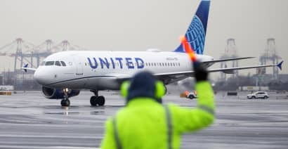 United results top estimates as demand remains resilient despite high fares