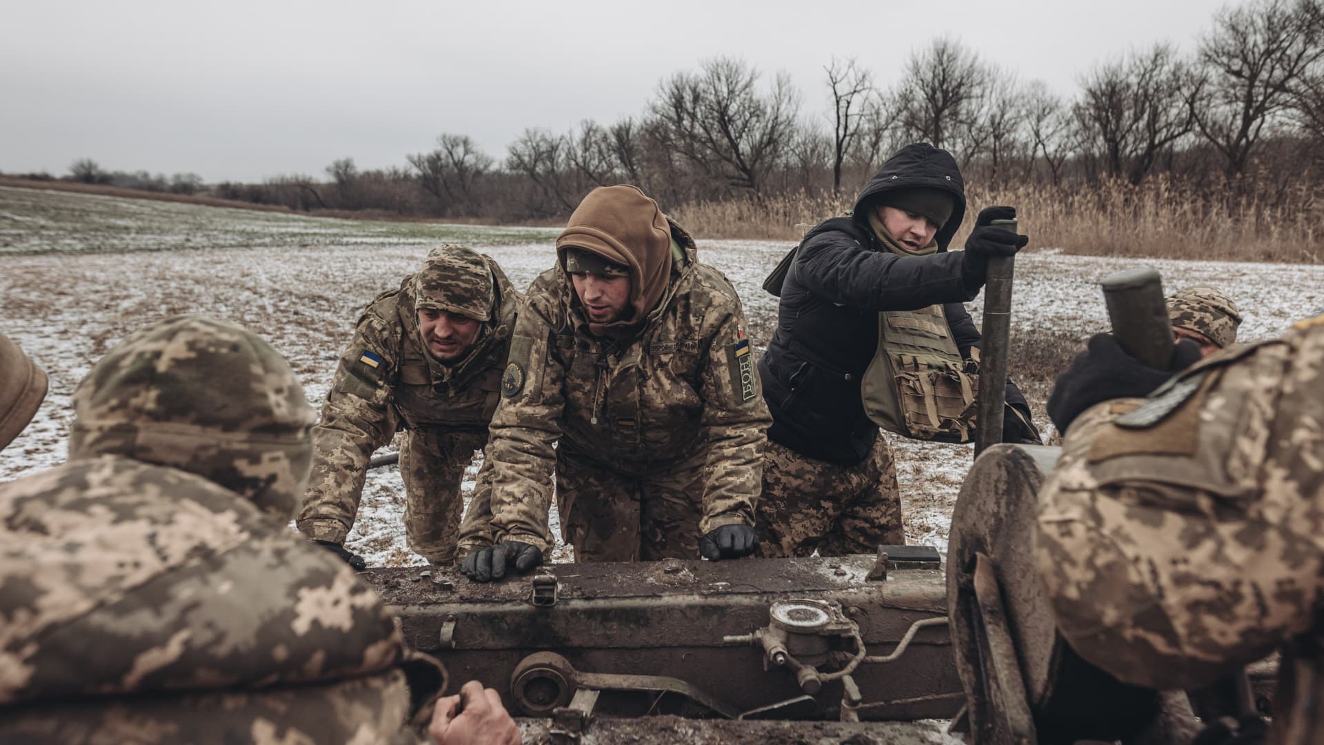 Ukrainian soldiers work in their artillery unit in the direction of Marinka in Donetsk on Jan. 15, 2023.