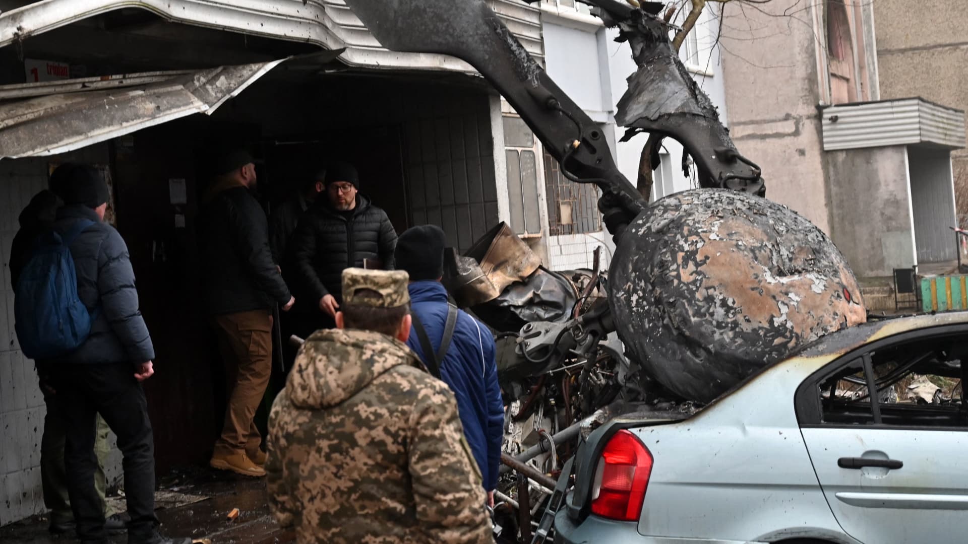 Military stand at the site where a helicopter crashed near a kindergarten in Brovary, outside the capital Kyiv, killing Sixteen people, including two children and Ukrainian interior minister, on January 18, 2023, amid the Russian invasion of Ukraine.