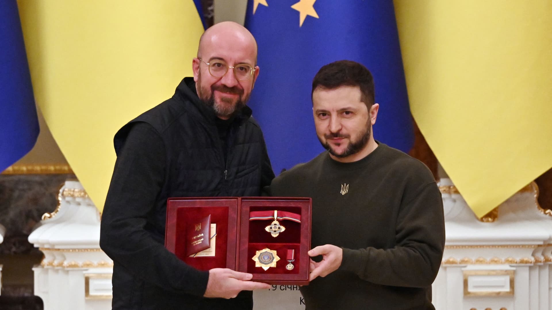 Ukrainian President Volodymyr Zelensky (R) awards the President of the European Council Charles Michel with the Order of Merit title during the press conference following their talks in Kyiv on January 19, 2023.