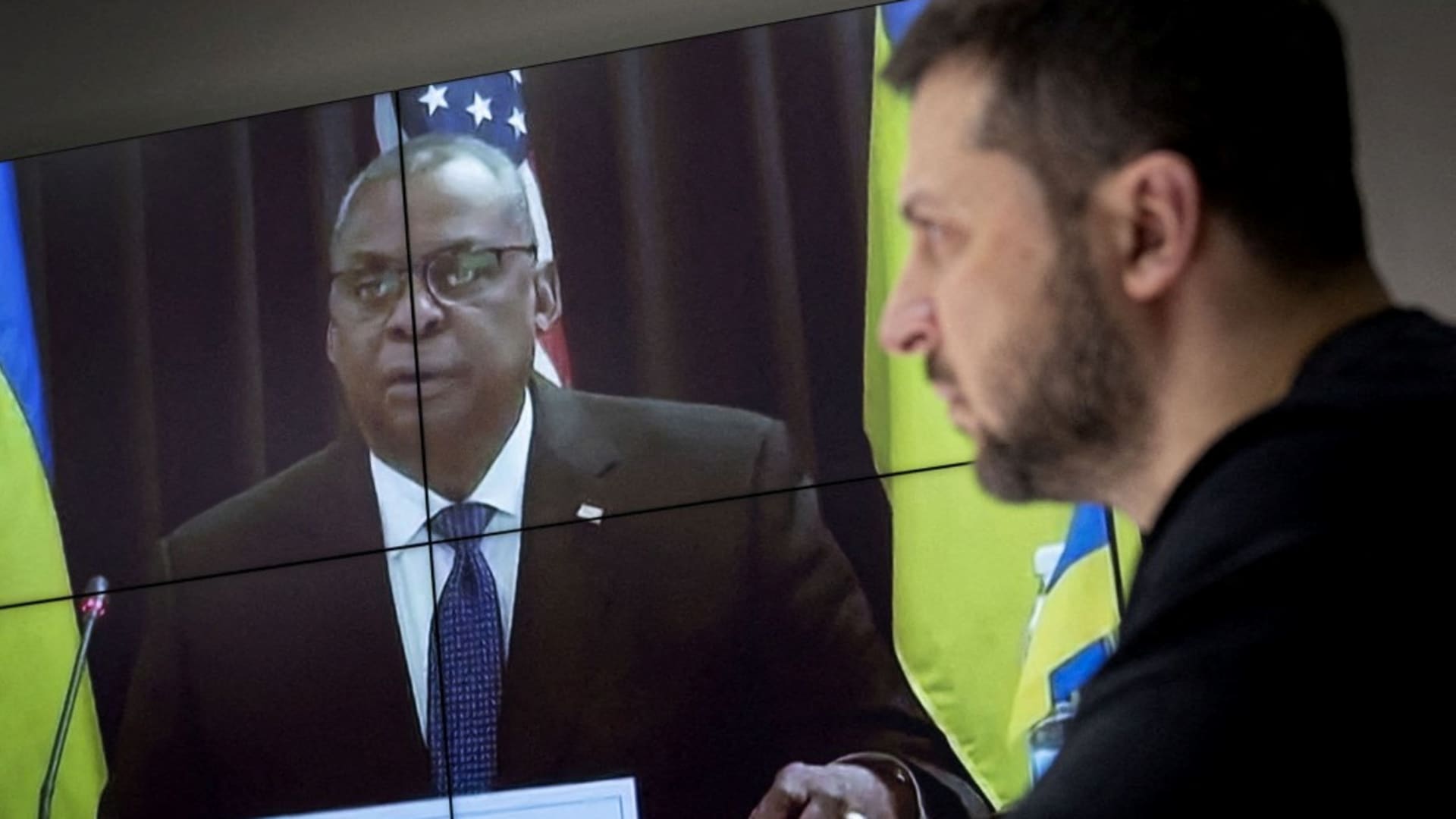 Ukraine's President Volodymyr Zelenskyy speaks via video link with U.S. Secretary of Defense Lloyd Austin (on screen) during a meeting of ministers of defense at Ramstein Air Base in Germany to discuss how to help Ukraine defend itself, amid Russia's attack on Ukraine continues, in Kyiv, Ukraine January 20, 2023. 