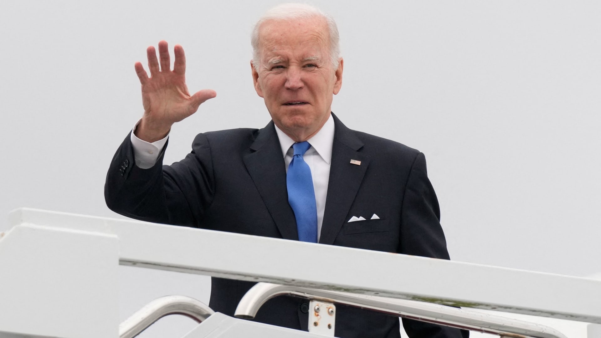 U.S. President Joe Biden waves as he boards Air Force One for return travel to Washington, at Dover Air Force Base in Dover, Delaware, January 23, 2023.