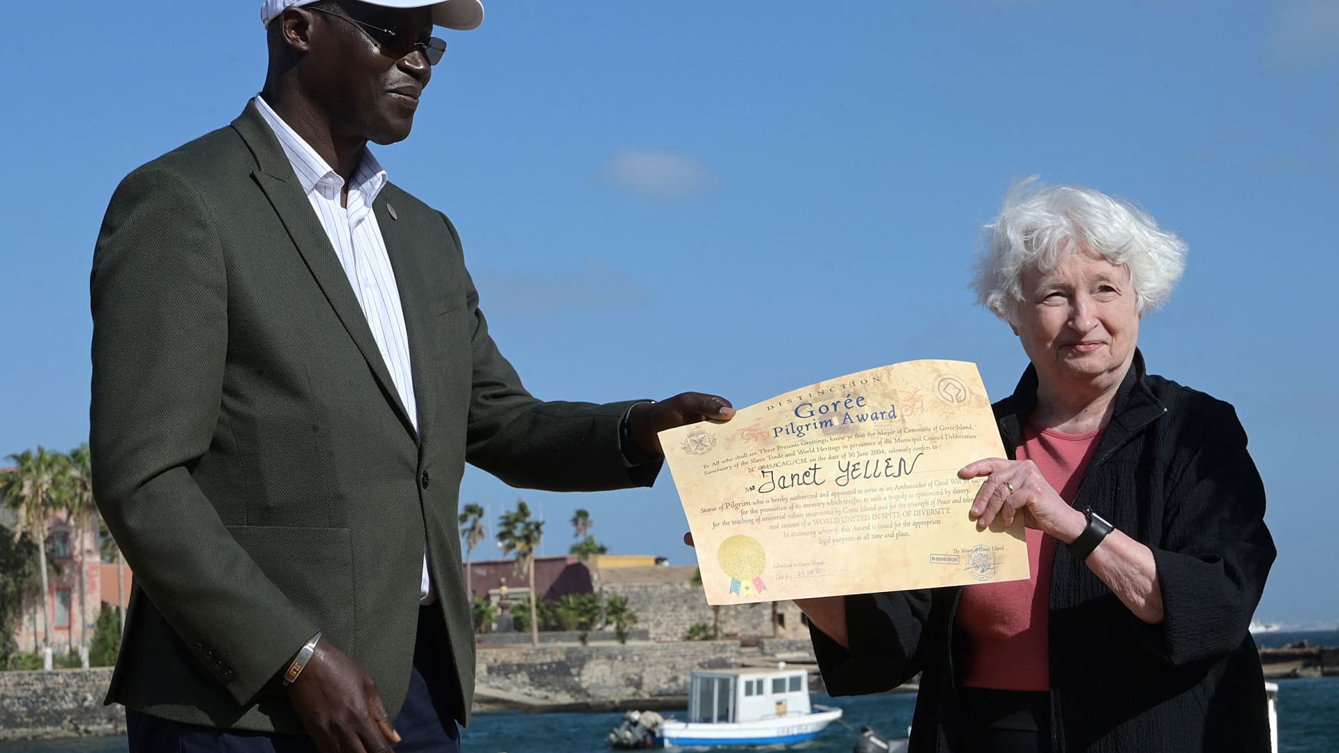 GOREE ISLAND, Senegal - Jan. 21, 2023: US Treasury Secretary Janet Yellen (R) receives an award diploma of Goree's Great Pilgrim from lawyer and Goree's mayor Augustin Senghor (L) during a visit on Goree Island off the coast of the city of Dakar on January 21, 2023.