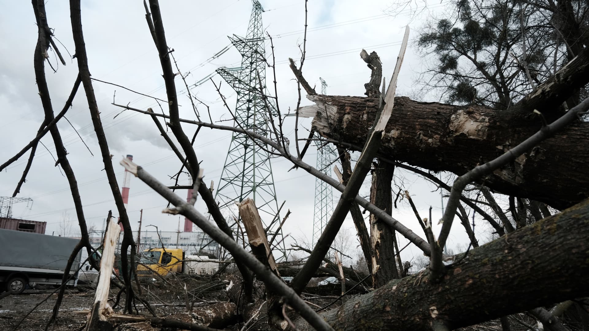 Broken tree limbs and other debris litter the ground at an industrial area in Kyiv following a morning missile strike that left one person dead and two wounded on January 26, 2023 in Kyiv, Ukraine.