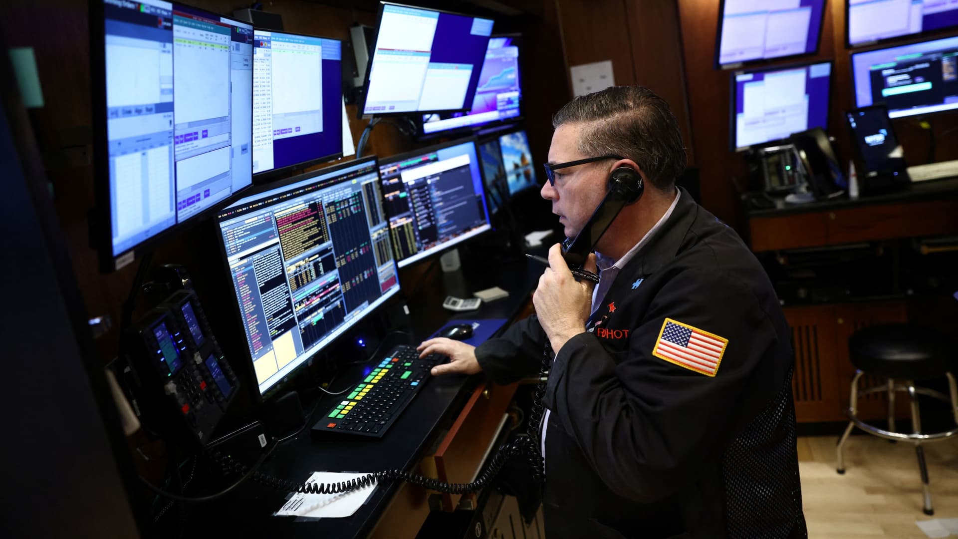 A trader works on the trading floor at the New York Stock Exchange (NYSE) in New York City, January 26, 2023.