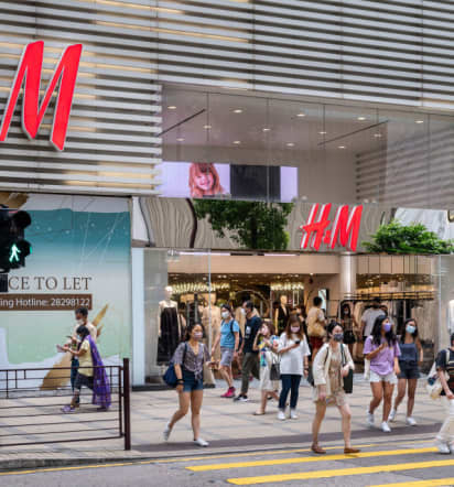 Fashion retailer H&M's profit tumbles more than expected as costs bite 