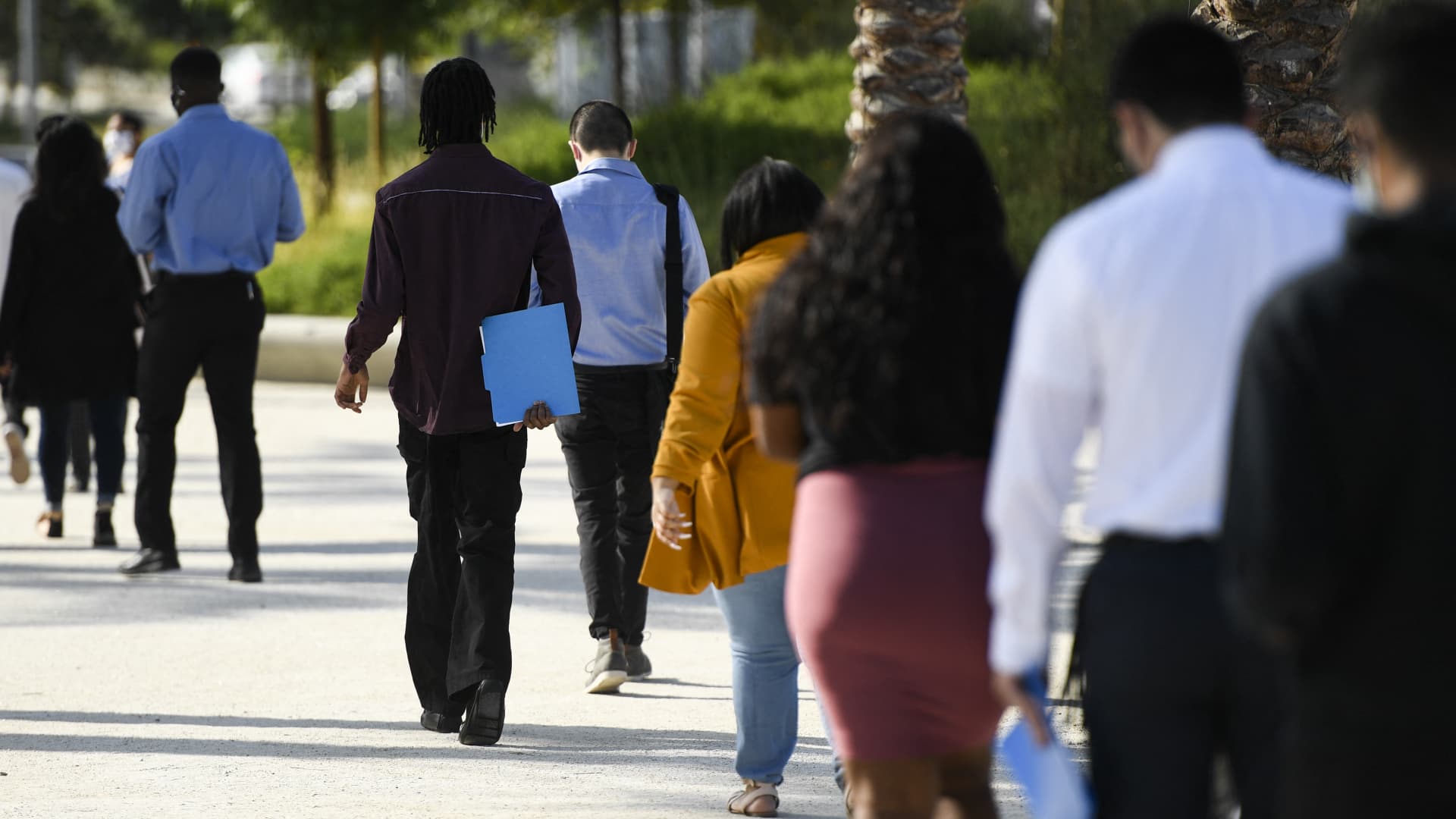 People wait in line to attend a job fair at SoFi Stadium on Sept. 9, 2021, in Inglewood, California.