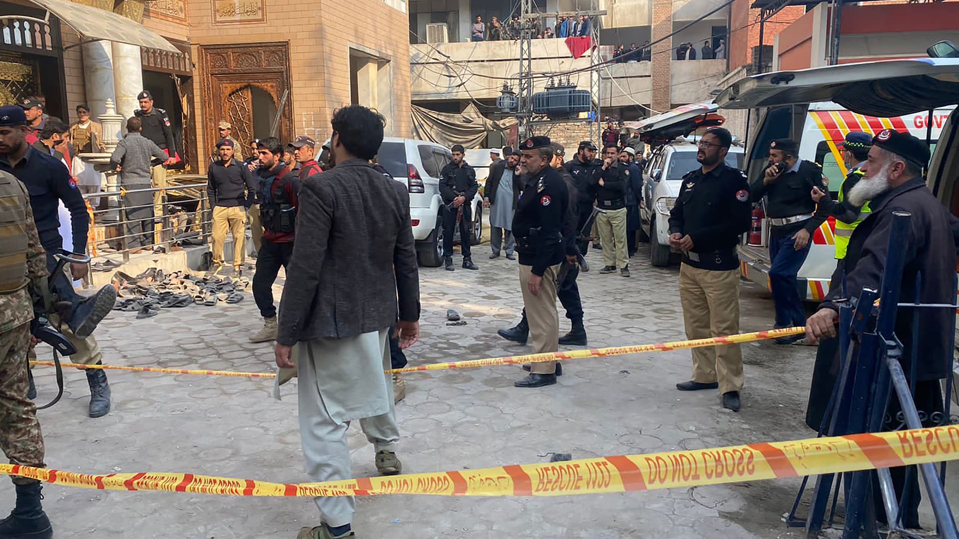 Security personnel cordon off the site of a mosque blast inside the police headquarters in Peshawar on January 30, 2023. - At least 25 people were killed and 120 were injured in a mosque blast at a police headquarters in Pakistan on January 30, a local government official said. (Photo by Maaz ALI / AFP) (Photo by MAAZ ALI/AFP via Getty Images)