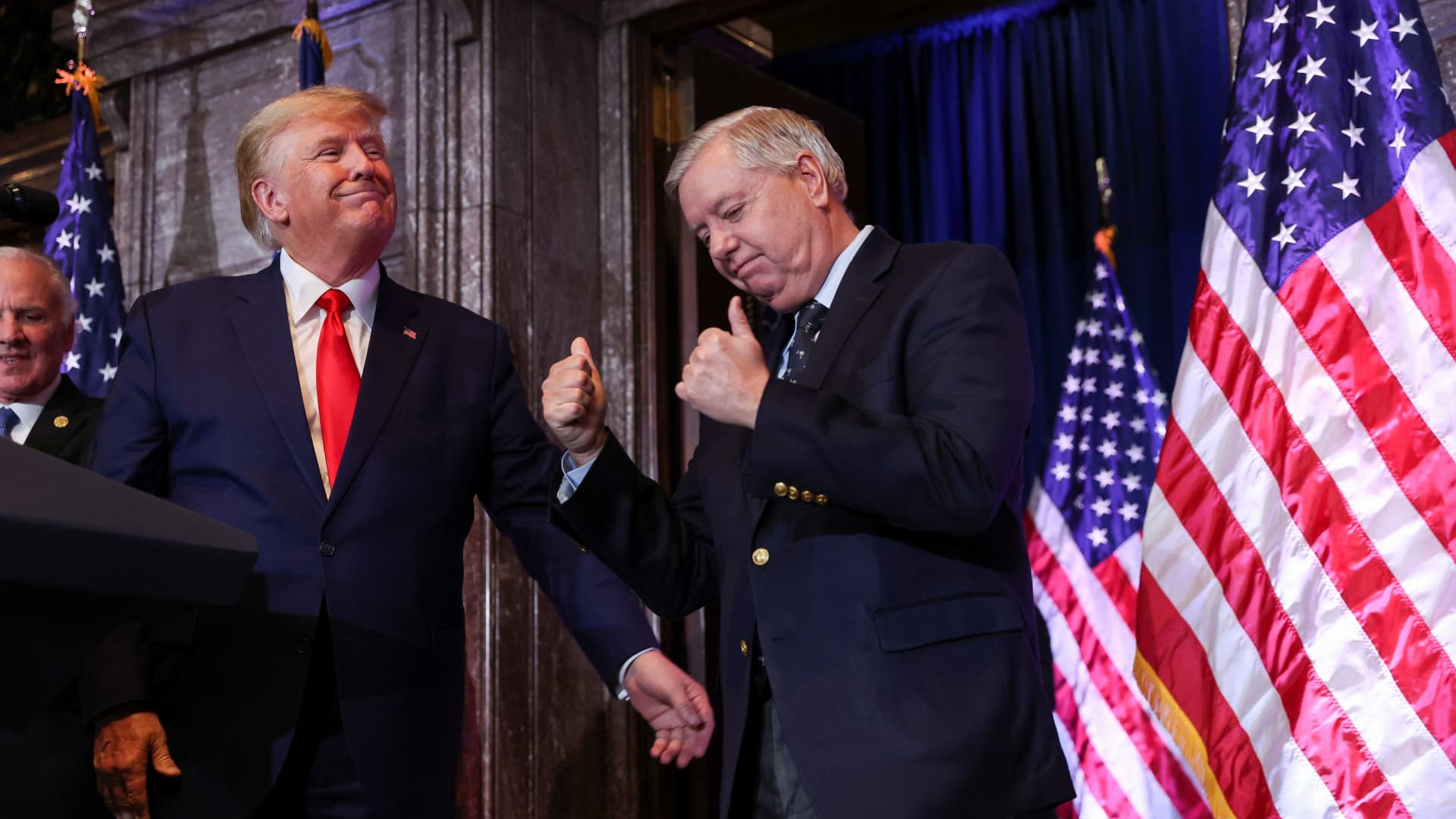 U.S. Senator Lindsey Graham (R-SC) gestures, while standing next to former U.S. President Donald Trump, during Donald Trump's campaign stop to unveil his leadership team, at the South Carolina State House in Columbia, South Carolina, U.S., January 28, 2023.
