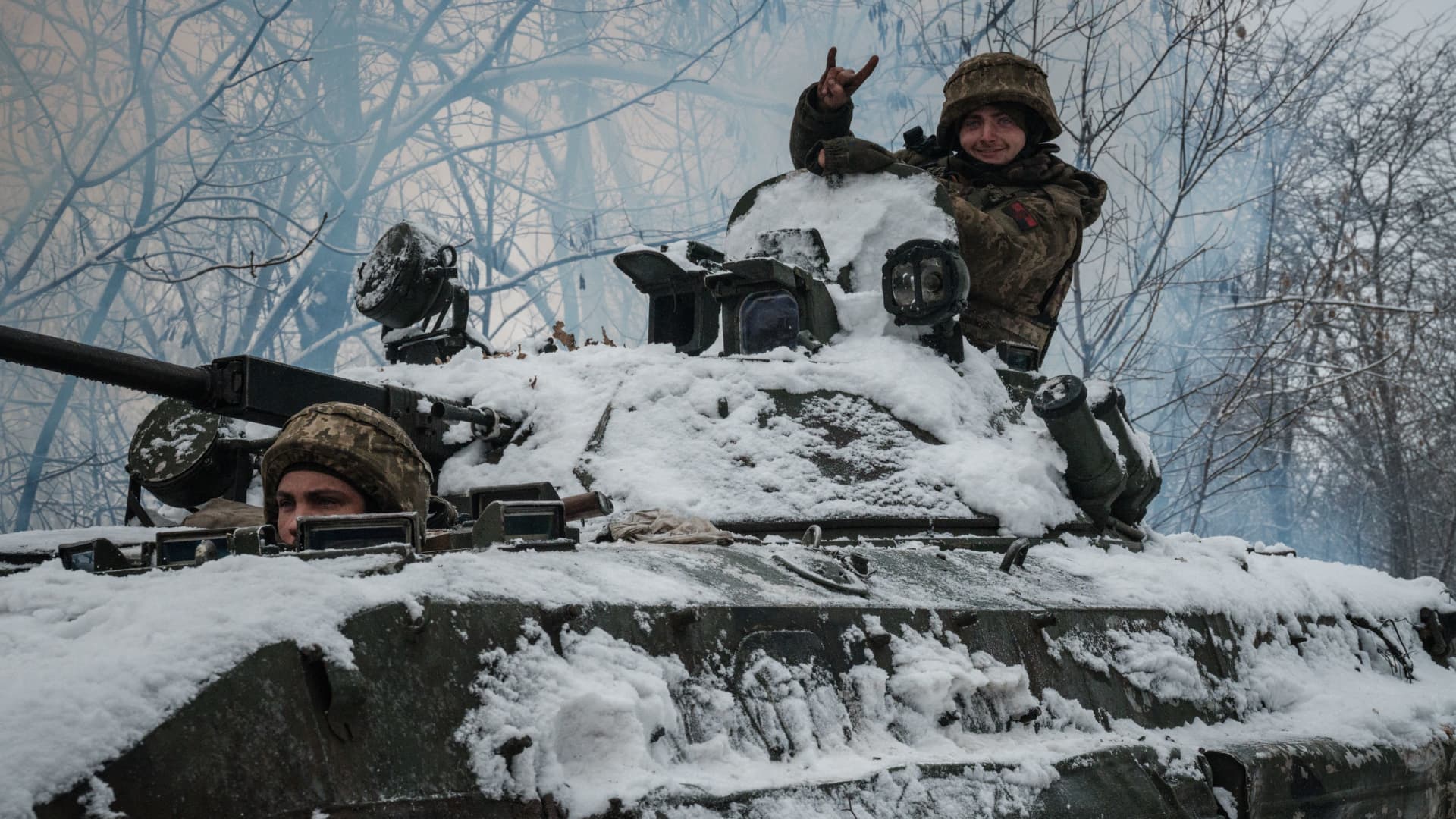 A Ukrainian serviceman gestures from atop a BMP-2 infantry combat vehicle in the Donetsk region on Jan. 30, 2023, amid the Russian invasion of Ukraine.
