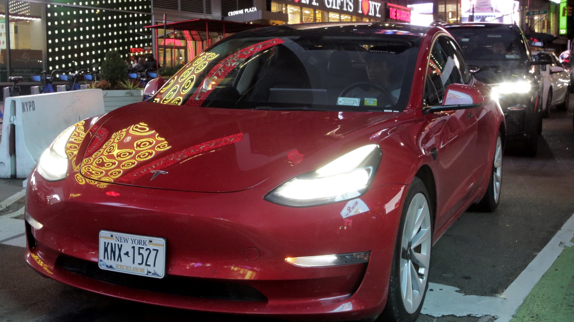 A Tesla sits in traffic at Times Square on Jan. 26, 2023 in New York City.