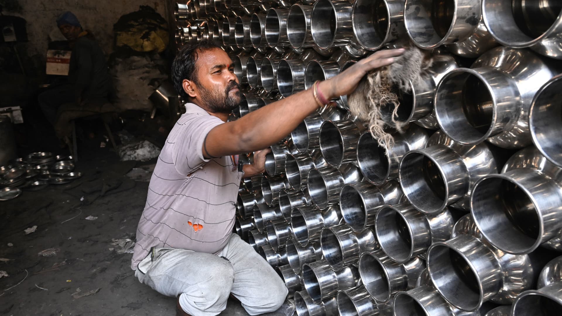 A laborer working at a stainless steel utensil workshop in Chennai on April 30, 2022.
