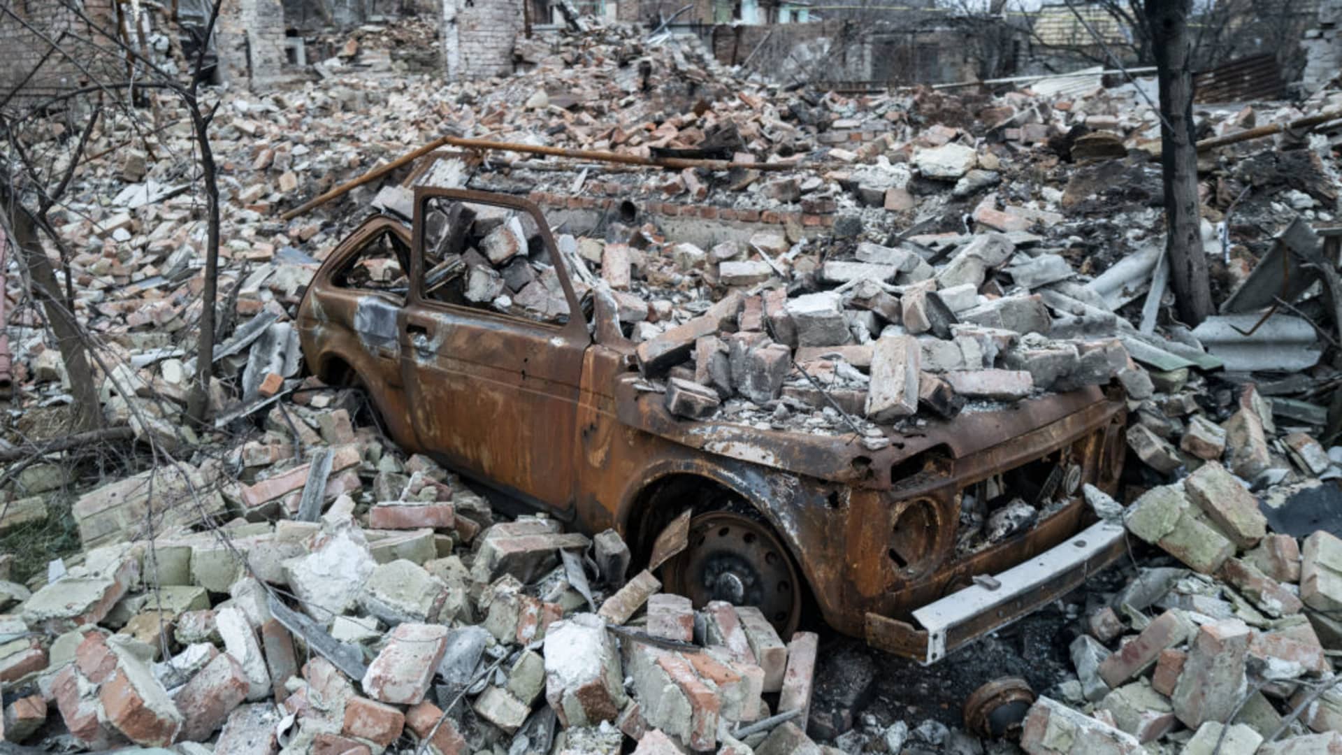A damaged car and pile of debris are seen as the Russia-Ukraine War continues in Bakhmut, Ukraine on January 28, 2023.
