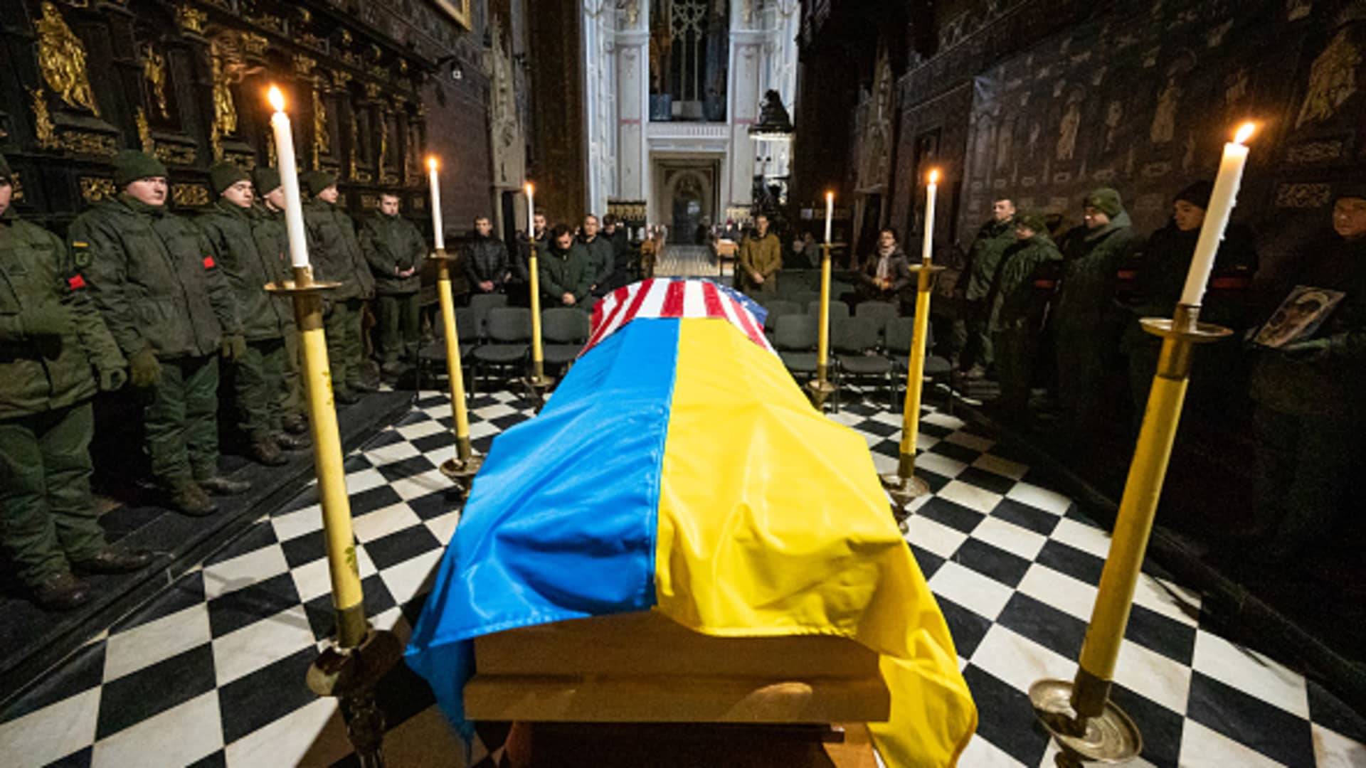 The coffin covered with US and Ukrainian flags and soldiers stand guard during the farewell ceremony in the Latin Cathedral on January 31, 2023 in Lviv, Ukraine. 
